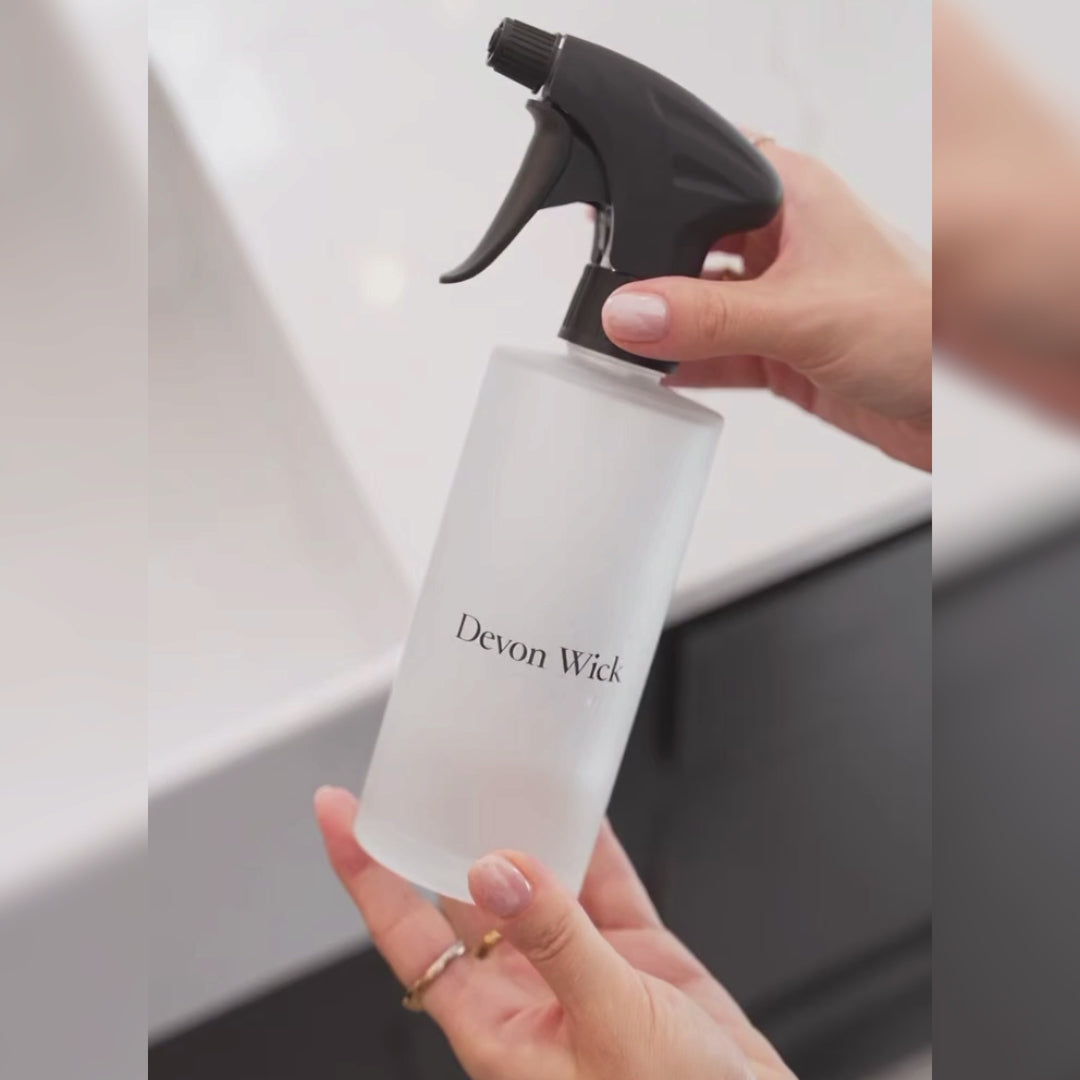 How to use The Signature Cleaning Set: pour a concentrate into the glass bottle, add water, then spray and wipe